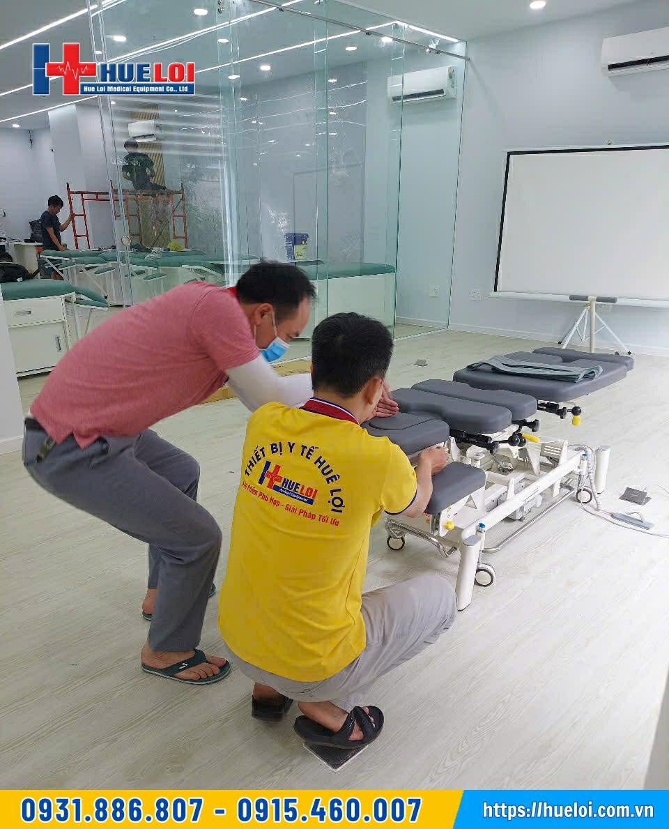 thiết bị y tế huê lợi bàn giao giường nắn chỉnh cột sống